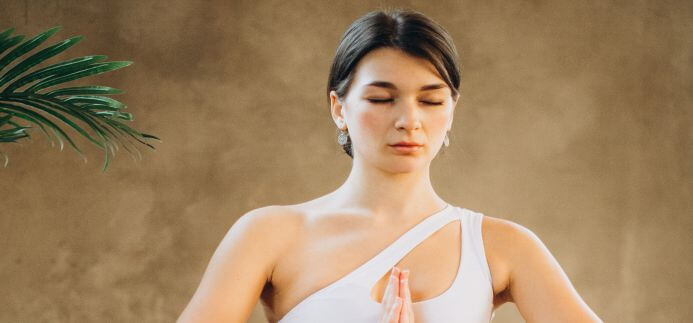 A lady meditating for mind management