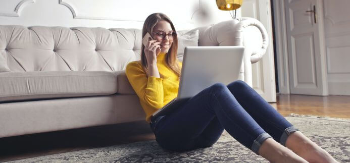 A lady in a long-distance relationship speaking with partner on the phone