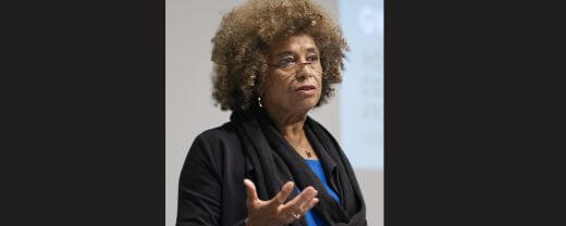 Angela Davis giving a talk as an independent thinker who always prioritized her own values, ideas, and convictions over outside pressure or influence