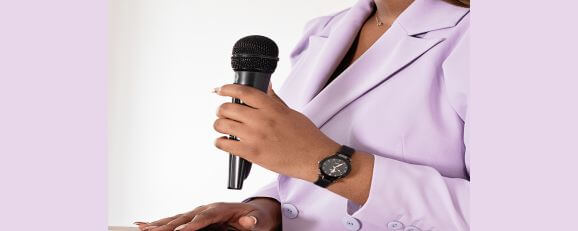 A woman with expert power on public speaking delivering a speech