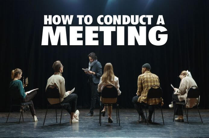 People in a meeting in a demonstration of how to conduct a meeting by the chairman