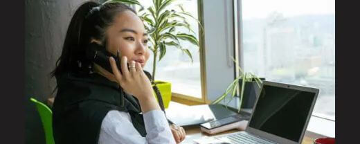 A customer care representative answering customer's call to show good relationship