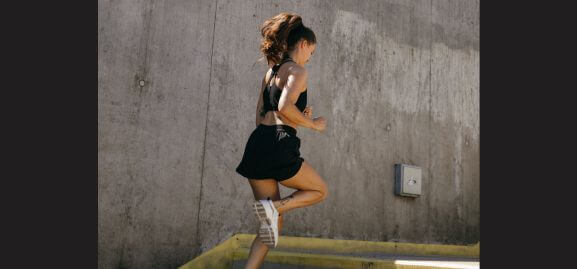 A lady jogging in demonstration of the physical pillar of life