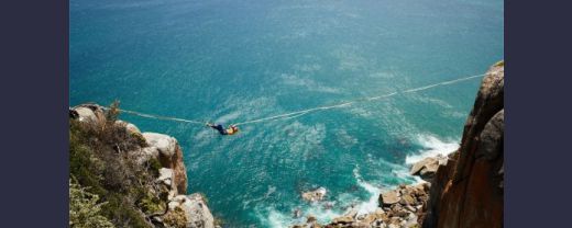 A boy climbing a rope to demonstrate risky behaviours of men