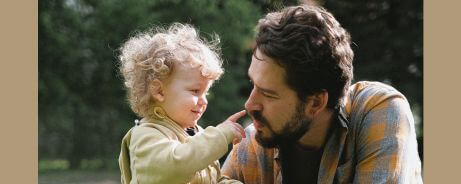 A real man at home and his curious daughter