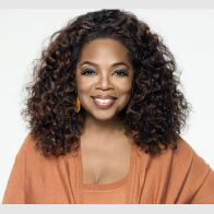 Am smiling Oprah Winfrey who embraced femininity and empowering women in self-improvement