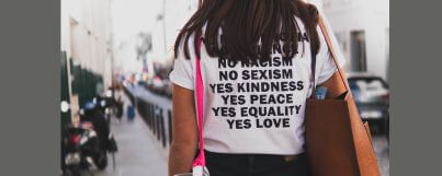 A woman wearing a Tshirt with "yes equality" inscription in advocating for gender equality