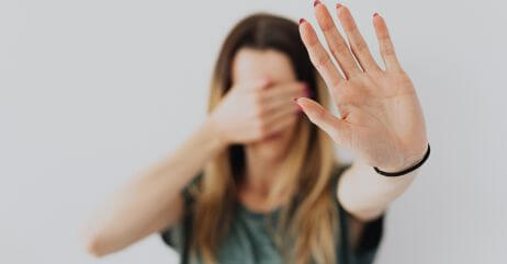 A young lady in fear, demonstrating how fear can be a powerful emotion used in persuasion