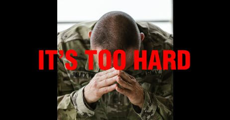 A soldier with head bowed in given-up posture as a result of negative self-talk