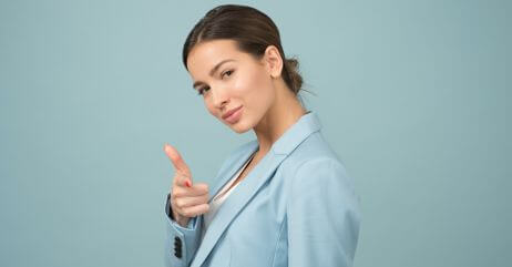 A lady in a pose in demonstration of self-esteem