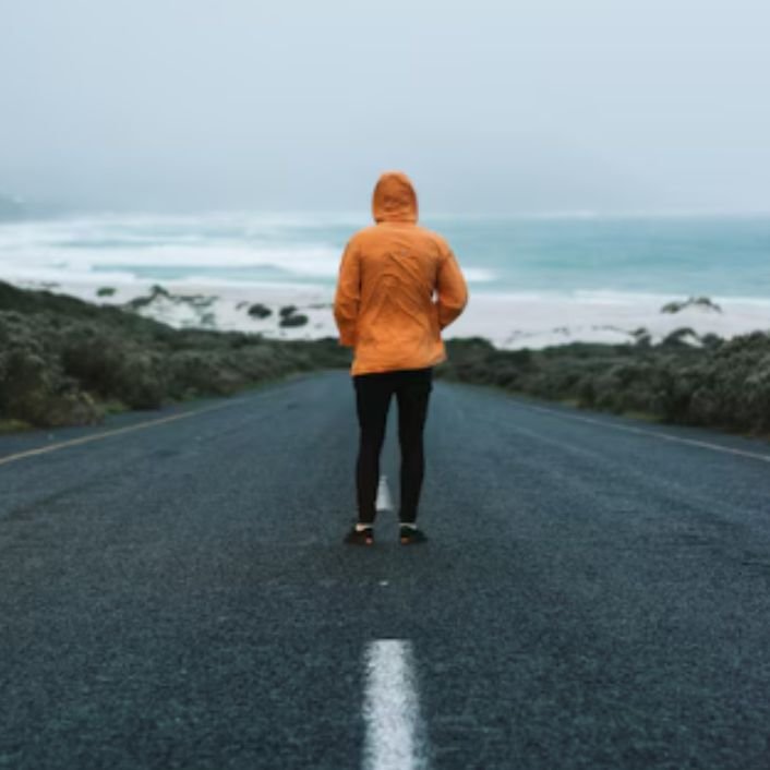 A person in the middle of the road looking ahead ' depicting how to live