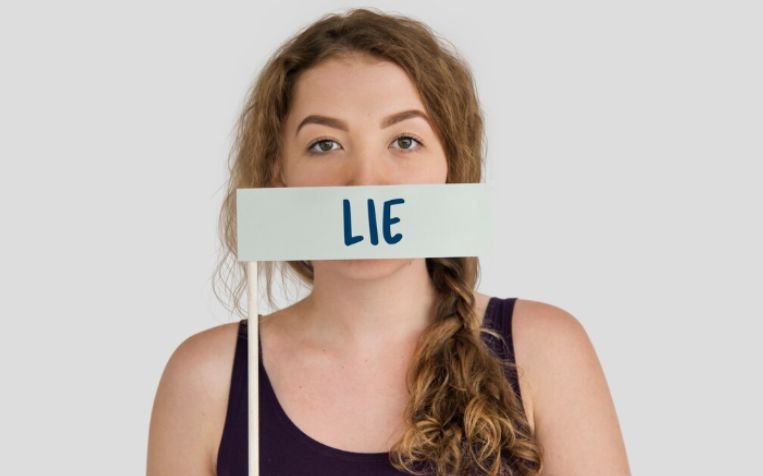 A lady showing physical cues of lying